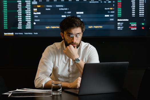 person comparing flight prices on laptop